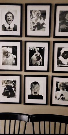 black and white photographs hang on the wall above a chair