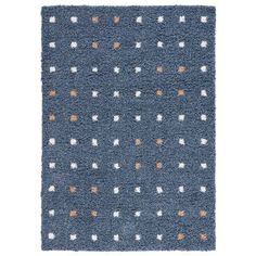 a blue rug with white and orange dots on it