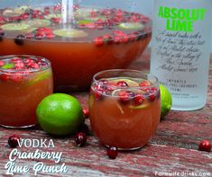 vodka cranberry lime punch is served in glasses with garnishes and fruit