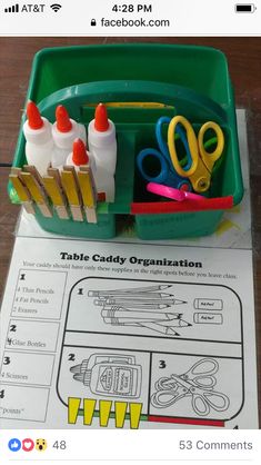 a green container filled with scissors and other crafting supplies on top of a table