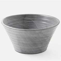 a gray bowl sitting on top of a white table