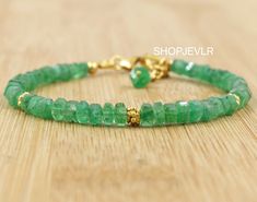 AAA QUALITY EMERALD RAW FACETED BEADED BRACELAT, BEST QUALITY. HANDMADE JEWELRY. Stone- Emerald Material- 925 Sterling Silver Finish- 18k gold filled Beads size- 3.45 to 4.36 MM External length- 1 inch If you are not sure about what size of bracelet you want to buy then Here is the size chart of the bracelet. Note :- The data given in the chart is not accurate. For Better results, measure your wrist size using tape/thread/scale. For Kids - 5 or 5.5 inches Adult Small - 6 or 6.5 inches Adult Med. Faceted Beads Bracelets As May Birthstone Gift, Faceted Beads Bracelet For May Birthstone Gift, May Birthstone Bracelets With Faceted Beads As Gift, Faceted Rondelle Bracelets As Gift, Faceted Rondelle Bracelet As Gift, Rondelle Faceted Bracelet As Gift, Hand-strung Bracelets As May Birthstone Gifts, Hand-strung May Birthstone Bracelets For Gifts, Bracelet Emerald