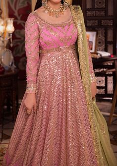 Introducing our New collection 'Chandni Raatein' by Asim Jofa designed to make you look and feel your best. Transformed into a living petal, this pink ensemble is a fairytale garden in bloom. The embroidered Peshwas, a delicate flower unfurling, is adorned with a cascade of light gold dewdrop-like sequins, coupled with 5mm and 9mm gold sequins amidst the intricate amalgam of gold zari and beige threads, weaving a glittering path guiding the gaze gently toward a blooming pink rose. The green embroidered dupatta, a verdant oasis, concludes this dreamlike story with a flourish. Embroidered Front Bodice on Chiffon Embroidered Back Bodice on Chiffon Embroidered Border for Front and Back Neckline, Bodice Hem and Armhole on Chiffon Embroidered Kalis for Peshwas on Chiffon Embroidered Border for H Pink Dabka Dupatta For Party Wear, Elegant Pink Lehenga With Dabka Detailing, Party Wear Anarkali Set For Wedding, Festive Pink Traditional Wear With Dabka, Festive Pink Sets With Mirror Work, Designer Pink Sharara With Dabka Work, Designer Pink Traditional Wear With Dabka Work, Pink Georgette Sharara With Sheer Dupatta, Pink Salwar Kameez With Zari Work For Reception