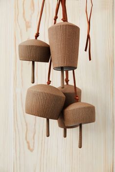 Red brown stoneware Canyon Clay Bells with leather hangings for indoor and outdoor. Five bells hanging in front of wooden background. Clay Bells, Desert Landscaping Backyard, Fun Beauty Products, Ceramic Bell, Wooden Coat Rack, Modern Mountain, Minimal Home, The Ceiling, Reddish Brown