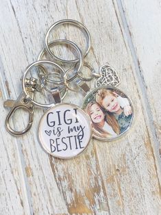 two personalized key chains with pictures on them