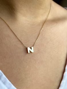 This necklace is made of solid 14K Solid Yellow Gold. We can provide any letter you want. Also it can be produced in 14K Solid White Gold or in 14K Solid Rose Gold as your request. Please contact with us via Etsy Message for different color. Letter pendant dimensions are Height: 6mm, Width: 6mm. Choose the letter you want from the letter options section. Weight of M Letter is 1,53 gr. Weight may change on different letters. It will be sent with signed certificate of authenticity. Necklace Length Everyday White Hallmarked Jewelry, 14k Gold Name Necklace In White, White 14k Gold Nameplate Jewelry, White 14k Gold Nameplate Necklace, White 14k Gold Name Necklace, 14k Gold White Name Necklace For Anniversary, White 14k Gold Name Necklace For Anniversary, Personalized 14k Gold White Name Necklace, Anniversary 14k Gold White Name Necklace