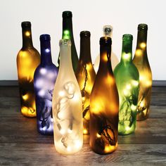 there are many bottles that have lights in them