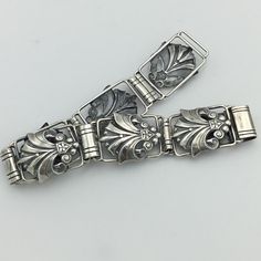 Rare collectible signed Candida for Joe Calafato silversmith. Sterling silver 1940s to 1950s ornate panel bracelet. 2.5cm widest & length 21cm. South Africa. Weight 32.3G. In good condition and clasp works. Guaranteed vintage C1940s Candida Joe Calafato and solid Sterling Silver and returnable if not delighted. Please see other items, happy to combine postage. No box included but have some to sell if need be.I guarantee safe arrival and description. Vintage Oxidized Antique Silver Bracelet, Antique Silver Hallmarked Metal Bracelets, Vintage Silver Jewelry With Historical Design, Antique Silver Bracelets With Box Clasp, Vintage Hallmarked Sterling Silver Bracelet In Antique Silver, Vintage Oxidized Silver Bracelet, Vintage Oxidized Silver Bracelets, Vintage Silver Bracelet With Oxidized Finish, Vintage Silver Bracelet With Box Clasp