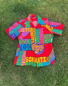 Vintage Schlitz Beer Shirt  - Rare  - Collector's item  - Schlitz Gusto spell out  - All over print design  - Deadstock  - 60s/70s vintage  - Cotton  Size: Medium  New with tag still attached  Good vintage condition  No rips or holes  No stains Multicolor Retro Print Shirt For Summer, Retro Shirt With Vibrant Spring Print, Multicolor Hawaiian Shirt With Graphic Print, Multicolor Graphic Print Hawaiian Cotton Shirt, Vintage Cotton Camp Shirt With Graphic Print, Vintage Short Sleeve Tops With Vibrant Print, Multicolor Cotton Hawaiian Shirt With Graphic Print, Retro Graphic Print Camp Shirt For Vacation, Retro Multicolor Hawaiian Shirt For Spring