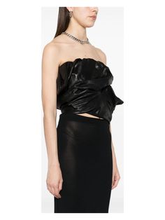 This little number combines edge and elegance effortlessly, like it's ready to steal the spotlight at any soirée. Crafted with a draped design in sumptuous calf leather, it's the kind of piece that whispers luxury while giving a playful nod to the avant-garde. You won't just wear it; you'll feel it, like a quiet confidence wrapped in leather. Black calf leather Draped, asymmetric design Strapless and cropped for a chic silhouette Fully lined for comfort Concealed rear zip fastening Season: SS24 Luxury Chic Bustier Crop Top, Luxury Chic Strapless Tops, Luxury Chic Leather Tops, Luxury Strapless Women's Tops, Luxury Black Chic Crop Top, Luxury Bustier Crop Top For Women, Luxury Strapless Tops For Women, Luxury Elegant Strapless Crop Top, Rick Owens Women