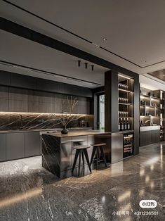 an elegant kitchen with marble counter tops and bar stools in the center, along with built - in shelving