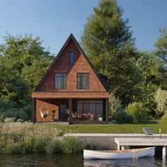 a house with a boat on the water in front of it and a dock next to it