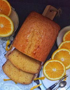 sliced oranges and slices of bread on plates