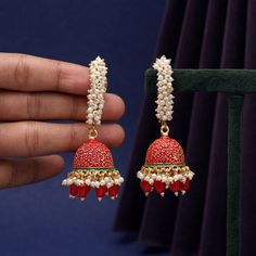 Earring Length: 7.00 CM x Width: 2.50 CM Metal: Alloy With Good Quality Gold Plated Color: Peach | Stone: Beads Gross Weight: 41.00 Grams Package Content: 1 Pair Of Earrings Earring Style: Jhumka Festive Red Hoop Earrings As Gift, Red Dangle Jhumkas For Party, Red Dangling Jhumkas For Party, Red Hoop Earrings With Latkans As A Gift, Red Hoop Earrings With Latkans For Gift, Gift Red Hoop Earrings With Latkans, Red Metal Earrings With Latkans, Red Drop Jhumkas For Party, Elegant Red Hoop Earrings With Latkans