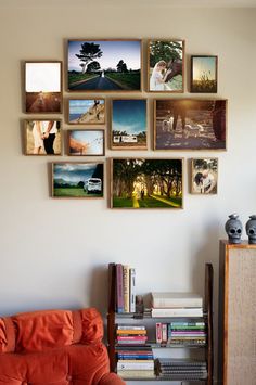 a wall with many pictures hanging on it