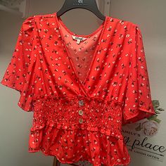 Red Blouse With Small White Flower Print Deep V Necklace And Cinched Waste To Flatter Hourglass Figures Size L But Fits More Like A Medium, Especially In The Chest Area, Unless, You Plan To Wear Without A Bra. Then I’d Agree With True To Size Red Floral Print Blouse For Summer, Red Summer Blouse With Floral Print, Red V-neck Top For Day Out, Red Floral Print Top For Day Out, Red V-neck Blouse For Day Out, Red Fitted V-neck Blouse Piece, Red V-neck Summer Blouse, Red V-neck Floral Print Top, Red Floral Print V-neck Top