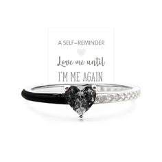 a black and white heart shaped diamond ring