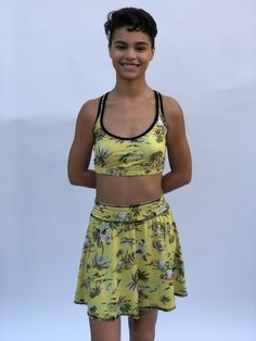 These comfortable and cute cropped bralets can be worn with the matching sports bra for added support. Paired with one of the many matching shorts, this top can be worn in the studio, as a bathing suit or out on the street. double sided with 2 different yet complimenting prints, made from recycled water bottles and spandex UV protection Moisture-wicking Crop Top Activewear For Summer, Sporty Crop Top With Built-in Shorts, Sporty Crop Top With Built-in Shorts For Gym, Casual Sports Crop Top With Built-in Bra, Summer Moisture-wicking Crop Top Activewear, Athleisure Crop Top With Built-in Bra For Beach, Summer Cropped Moisture-wicking Activewear, Summer Sleeveless Gym Activewear, Workout Crop Top With Built-in Shorts