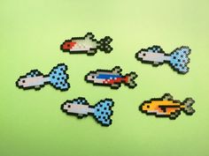 six pixelated pieces of different shapes and sizes on a green surface with space shuttles in the middle