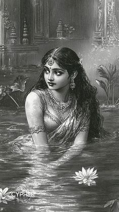 a woman sitting in the water with long hair