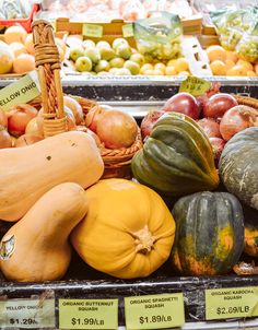 there are many different fruits and vegetables on display