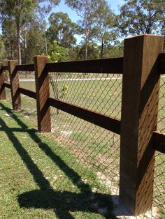 the fence is made out of wood and wire