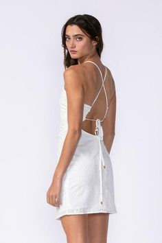 Things are heating up in the Gia White Eyelet Halter Mini Dress! Embroidered eyelet a plunge neckline (that you can criss-cross to create a keyhole neckline) and dual straps that criss cross and tie in the back. A low back connects to a figure-hugging bodycon mini skirt. Lined. DETAILS & CARE Cotton/Polyester. Dry Clean. Imported. ORDERS, SHIPPING & RETURNS Orders, Shipping, & Returns Spring V-neck Cross-tied Dresses, Fitted V-neck Eyelet Dress, Spring V-neck Dress With Wrap-around Straps, Spring V-neck Dress With Crisscross Straps, Cross-tied Mini Dresses For Summer, Chic Eyelet V-neck Dress, Cross-tied Mini Length Summer Dress, Summer Cross-tied Mini Dress, Backless Cross-tied Beach Dress