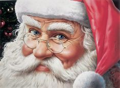 a close up of a santa claus face wearing glasses and a red hat with a christmas tree in the background