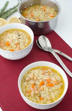 two bowls of soup on a red place mat