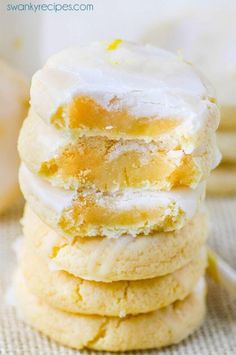 a stack of lemon cookies with frosting on top