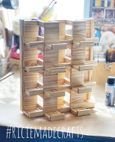 a stack of wooden blocks sitting on top of a table