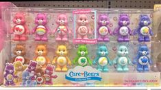 there are many care bears on display in the store for $ 3 99 per bear