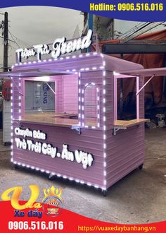 a purple food cart with lights on the side and words that read, there's a friend