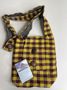 Homemade Crossbody Bag Boho Hippy Made In Nepal Yellow Red Plaid-8X9X3 NWT. Really cool and fun design bag/purse. Nicely lined with an inner pocket. “Topline” company can’t be found anymore but the product is made well. Measurements are shown in the pictures as well in the title. Examine pictures closely to see details. (6/29) Casual Crossbody Shoulder Bag For Personal Use, Rectangular Bag With Snap Closure As Gift, Rectangular Shoulder Bag With Snap Closure For School, Design Bag, Fun Design, Red Plaid, Nepal, Hippie Boho, Bags Handbags