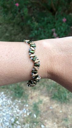 Hope you found all you needed, feel free to look around. Beautiful wavy Czech glass bracelet in color gold and army green looks great with most outfits. Beads have a duracoat coating to keep their beautiful color. Great gift for a special someone in your life.  Items are already made and ready to ship with in 1-3 business days and I will message you with a tracking number when ready.  Please see policies for exchanges and return information. Feel free to contact me with any problems you may have Elegant Green Round Beads Friendship Bracelets, Elegant Adjustable Green Friendship Bracelets, Elegant Green Beaded Bracelets For Friendship, Green Ocean-inspired Beaded Bracelet For Gift, Elegant Hand-strung Green Beaded Bracelets, Dainty Green Hand-strung Beaded Bracelets, Green Multi-strand Bracelet With Colorful Beads, Green Adjustable Multi-strand Beaded Bracelets, Roanoke Va