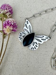 This gorgeous sterling silver and black jade butterfly pendant started out as raw materials of silver sheet and wire. Crafted entirely by hand with love in my home studio in North Carolina all of my pieces are artisan made, handcrafted, unique, one of a kind, and heirloom quality. The 925 sterling silver paperclip chain was also hand fabricated and measures 17 1/2 inches long. The butterfly itself measure about 1 1/4 inches long and 1 1/2 inches wide. The stone is called "black jade" and has a lovely matte finish. Great gift for nature lovers. Handmade Silver Butterfly Necklace, Unique Handmade Silver Butterfly Necklace, Black Butterfly-shaped Jewelry For Gift, Unique Silver Butterfly Pendant Necklace, Black Butterfly Jewelry For Gift, Black Butterfly Charm Jewelry, Unique Sterling Silver Butterfly Necklace, Unique Sterling Silver Jewelry With Butterfly Charm, Handmade Black Butterfly Jewelry