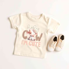 Your toddler will look adorable in this "HOLY COW IM CUTE" Skeleton Toddler short sleeve tee. This lightweight side-seamed shirt maximizes comfort all day long.  Holy Cow I'm Cute Toddler Shirt, Funny Cow Baby Tee, Cute Cow Natural Tshirt, Farmer Western Country Baby Gift, Animal Lover T-Shirt 🌟100% Airlume combed and ringspun cotton (fiber content may vary for different colors) 🌟Light fabric (3.9 oz/yd² (132 g/m 🌟Retail fit RETURNS: All products are made-to-order and because of the nature of these items, all sales are final unless they arrive damaged or defective. CARE INSTRUCTIONS Machine wash: cold (max 30C or 90F); Non-chlorine: bleach as needed; Tumble dry: low heat; Iron, steam or dry: medium heat; Do not dryclean. PLEASE SEE THE SIZING CHARTS for the measurements, and please cons Cute T-shirt With Funny Print, Funny Toddler Shirt, Cute Skeleton, Funny Cow, Cow Tshirt, Cows Funny, Cute Cow, Holy Cow, Cute Cows