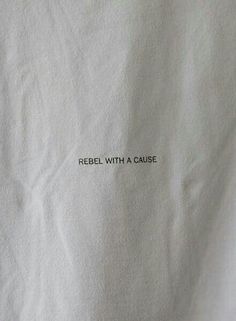 a piece of white paper with the words rebel with a cause written on it