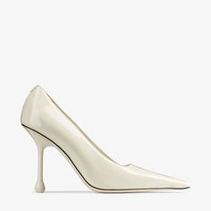 The Ixia elevates the classic pump with a contemporary drop heel and square-cut vamp. Italian-crafted from sleek patent leather in a muted latte shade, this modern shoe is an understated yet glamorous complement to your staple collection. It features a pointed toe and is set on a flattering 95mm heel. Modern Patent Leather Court Shoes With 4-inch Heel, Elegant Fitted Cream Court Shoes, Cream Patent Leather Heels For Evening, Modern Cream Patent Leather Heels, Modern Fitted Court Shoes With Sculpted Heel, Classic Cream Patent Leather Heels, Sleek Patent Leather Heels With Square Toe, Elegant Court Shoes With Sculpted Heel And Square Toe, Modern Cream Square Toe Heels