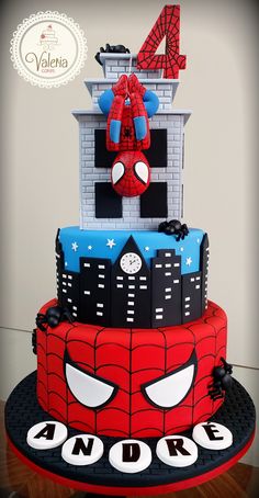 a spiderman themed birthday cake on a table