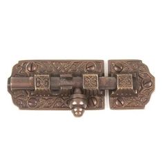 two antique style door handles with decorative designs