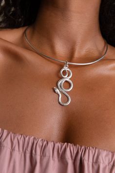 A single snake in 18K gold plated ancient bronze or sterling silver with sapphire eyes suspended on a 30” snake chain or a delicate neck cuff. Named after the goddess of healing Eir, this piece is a staple of The Rebirth collection. This timeless necklace is inspired by ancient Greek and Egyptian jewelry. I’ve envisaged the snake as the symbol of life and regeneration, healing, and growth. I hope it will serve as a talisman of power and protection. Total length 2.7'' Total width 1'' Goddess Of Healing, Greek Goddess Of Wisdom, Female Deity, Timeless Necklace, Sapphire Eyes, Symbol Of Life, Egyptian Jewelry, Life Symbol, The Snake