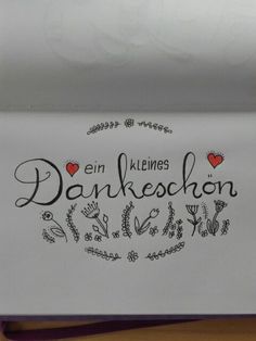 a close up of a piece of paper with writing on it that says dankeschon