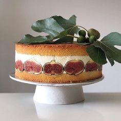 a cake with figs and leaves on top