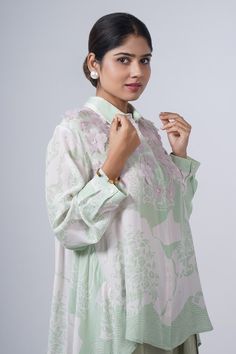 Green printed asymmetric hem shirt with 3D floral appliques. - Aza Fashions Spring Silk Top With Collared Neckline, Elegant Long Sleeve Tops With Floral Applique, Spring Silk Blouse With Floral Embroidery, Silk Tunic Blouse For Spring, Spring Silk Tunic Blouse, Elegant Floral Print Tunic Blouse, Elegant Floral Tunic Blouse, Pankaj And Nidhi, 3d Shirt