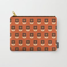 an orange and brown flower pattern carry - all pouch