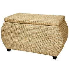 a large wicker ottoman with black legs and a lid on it's side