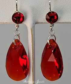 Swarovski Crystal Light Siam drop from a simple hook, for an elegant look These drop approximately 1 inch including the ear wire. Red Teardrop Jewelry With Matching Earrings, Red Drop Jewelry With Matching Earrings, Red Drop Crystal Earrings As Gift, Red Drop Earrings For Pierced Ears, Elegant Red Drop Crystal Earrings, Red Hypoallergenic Jewelry For Formal Occasions, Red Hypoallergenic Jewelry For Party, Hypoallergenic Red Jewelry For Formal Occasions, Red Hypoallergenic Party Jewelry