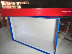 an open red and white box with blue trim on the bottom is sitting on a table