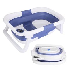 a blue and white baby bath tub with the lid open next to it's tray